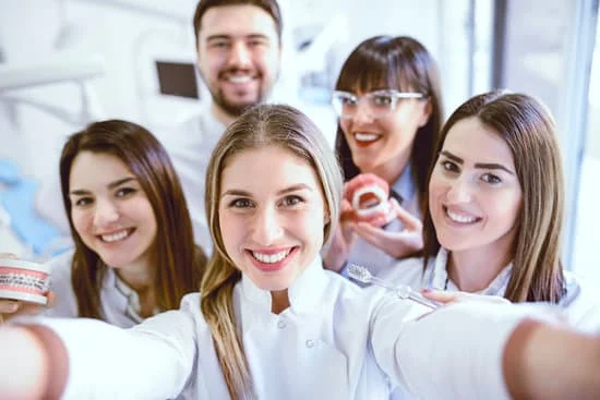 Staff members in a Dental Clinic celebrating an event with a selfie